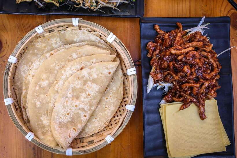 Beijing: Hidden Gems Guided Food Tour with Beer and Tastings - Spring pancakes and the meaning of family