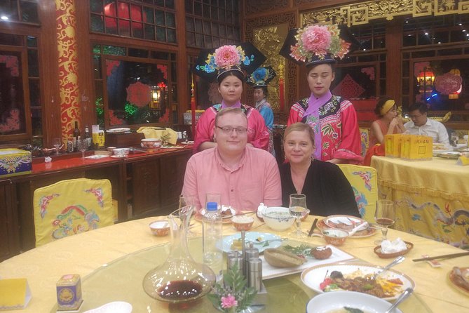Beijing Imperial Dining Experience at Bai Jia Da Yuan Restaurant with Houhai Lake Bar Tour - Beijing after dark: Olympic architecture and old towers
