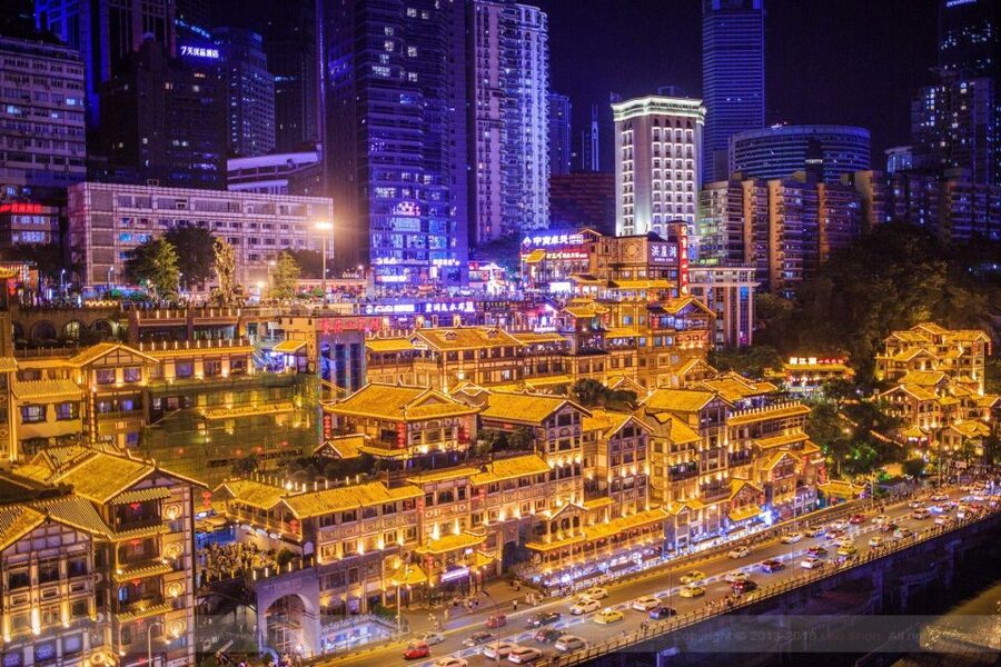 Chongqing: Illuminated Night Tour with Cruise or Hot Pot - Jiefangbei after dark: shopping towers and street snacks