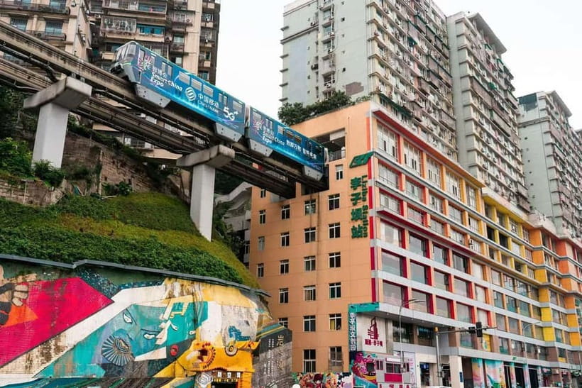 Chongqing: Surreal Urban, Ancient Town, and Secret Viewpoint - Liziba Monorail and the train inside the tower
