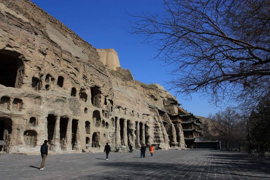 Datong: Temples and Grottoes day tour with tickets options - Entering the 53 caves at Yungang
