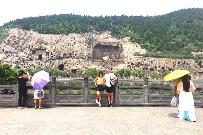 Form Xi'an To Luoyang Longmen Grottoes & Shaolin Temple Day Tour by Bullet Train - Longmen Grottoes and the river of carved Buddhas