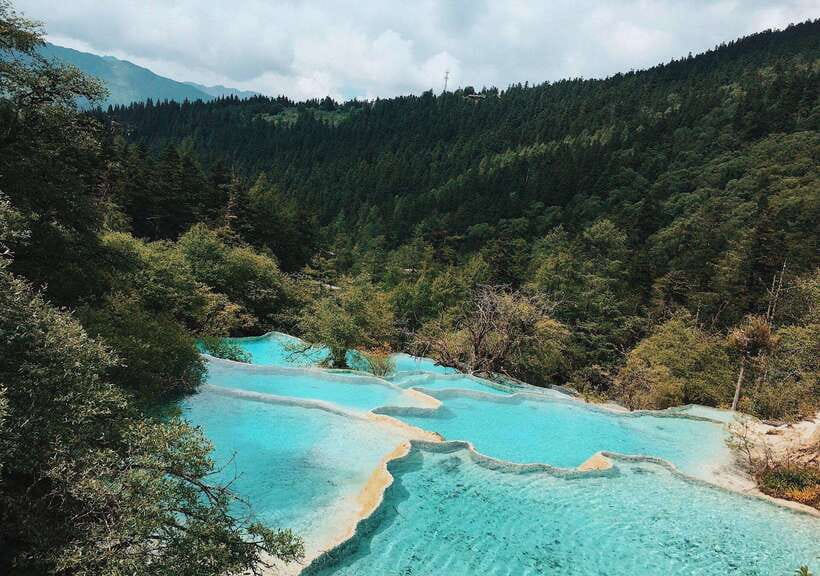 Huanglong Scenic Area: Explore Stunning Five-Colored Ponds - Five-Colored Ponds and the upper valley