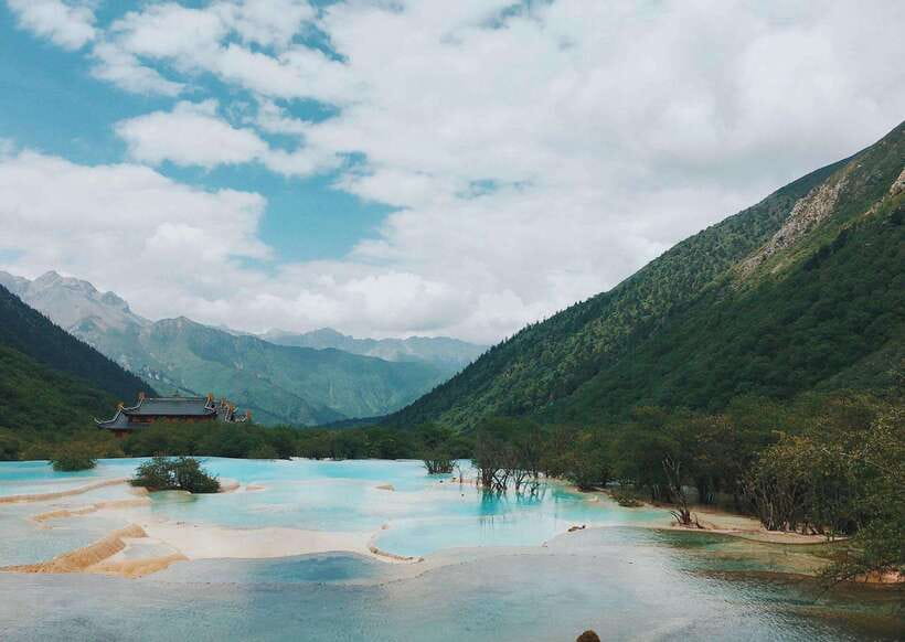 Huanglong Scenic Area: Explore Stunning Five-Colored Ponds - Forests, canyons, and possible wildlife