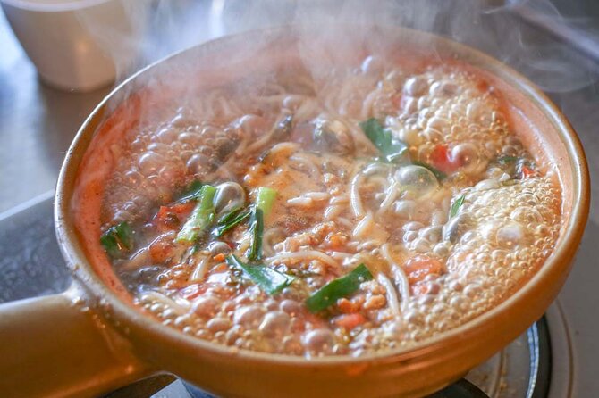 Lijiang Naxi Cuisine Cooking Class & Market Visit - Preparing and eating three dishes