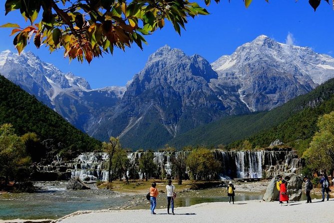 One day Jade Dragon Snow Mountain Tour with Impression Lijiang show - Riding through Baishui River