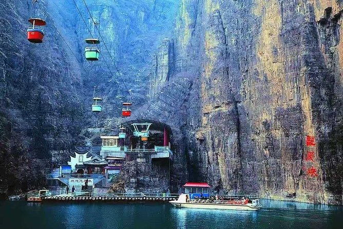 Private Transfer to Longqing Gorge and Guyaju Caves Excursion by English Driver - Longqing Gorge: cliffs, water, and the Little Lijiang River