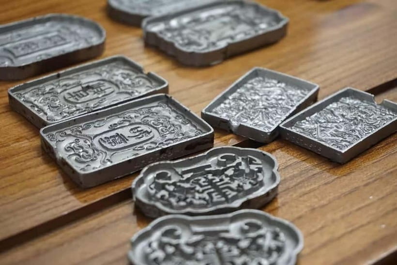 Shanghai: Hands-on Incense Tablet Making Class - Pressing the clay into symbolic molds