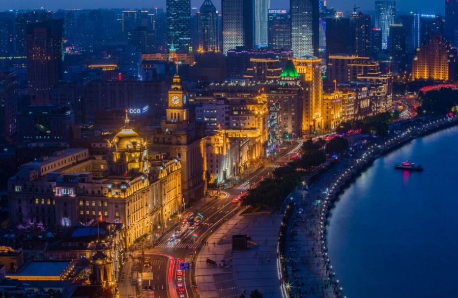 Shanghai: Night River Cruise Tour with Xinjiang Style Dining - Hotel pickup and the ride to the Huangpu River
