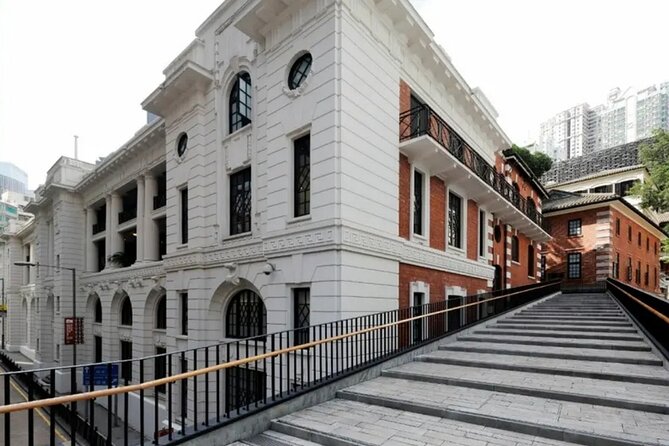 Top-Rated Hong Kong Tour: Peak Tram, Dim Sum & Cultural Sights - Returning by tram and entering Old Town Central