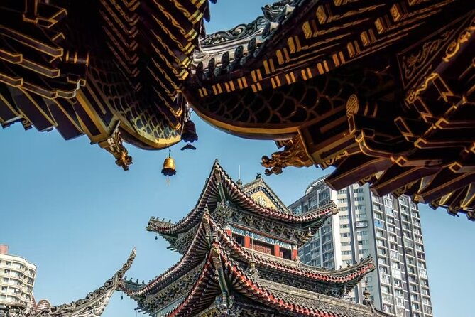 True Taste of Chongqing: Offbeat Walks & Hotpot in One Day - Jiefangbei shows the modern mountain city