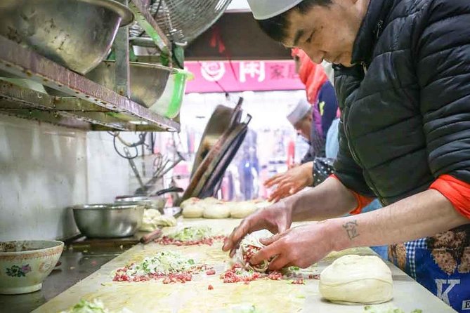 Xi'an Morning Food & Market Tour by TukTuk - Four or five stops, from tables to street stalls